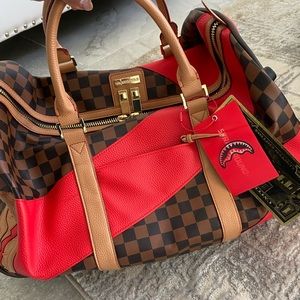 Sprayground duffle bag with wheels